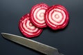 Sliced raw Ã¢â¬â¹Ã¢â¬â¹beetroot on black background Royalty Free Stock Photo